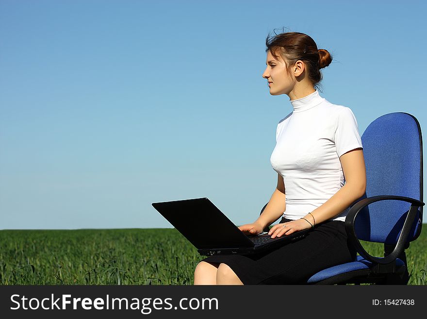 Young woman with laptop outdoor. Young woman with laptop outdoor