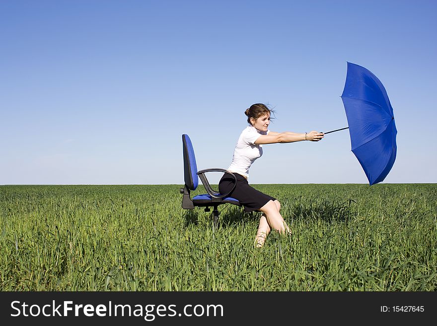 Young Girl With An Umbrella Wind Carries Away