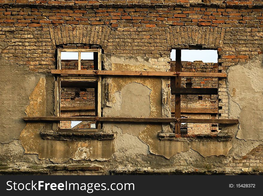 Ruin brick facade with two window's