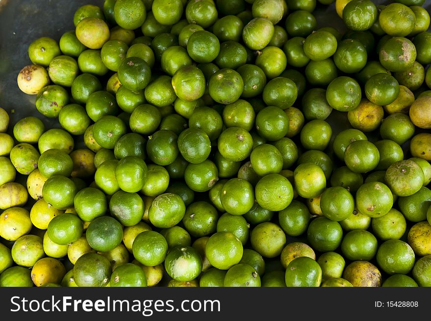 Fresh Green Limes sell at market
