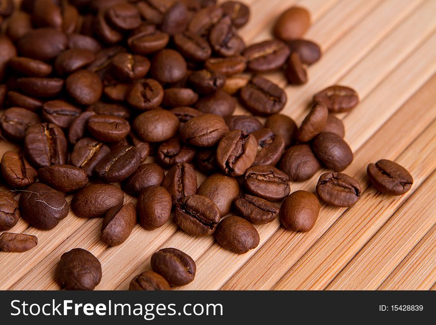 Closeup coffee beans on wood wall
