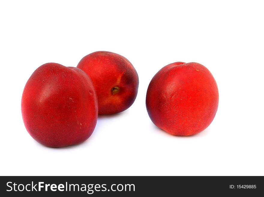 Three  ripe nectarines isolated on white background. Three  ripe nectarines isolated on white background