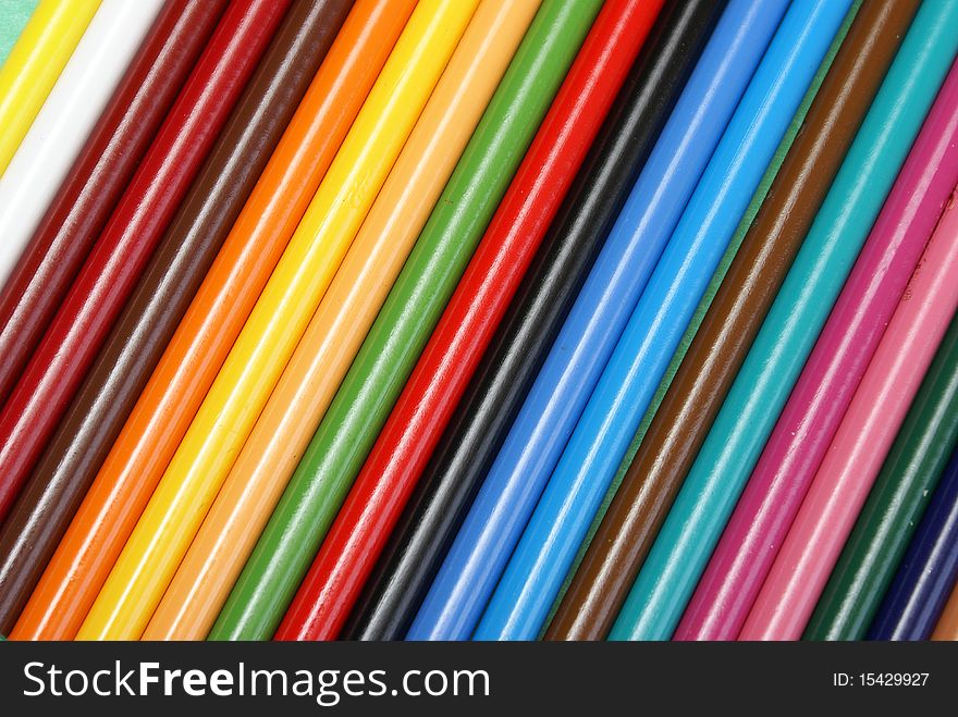 A colorful background made from a macro shot of pencil crayons.