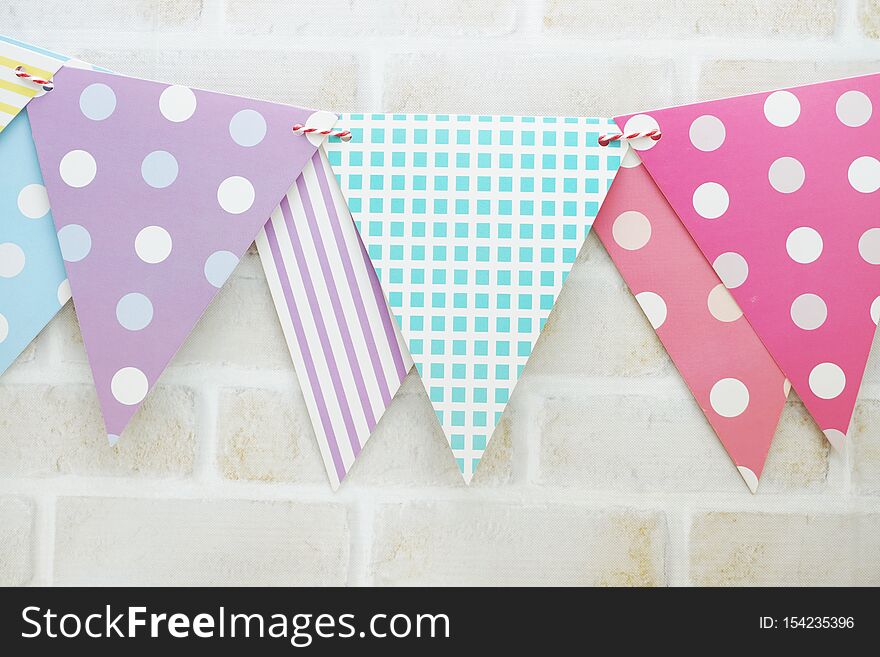 Colorful Bunting Hanging With Space Copy On Wooden Background