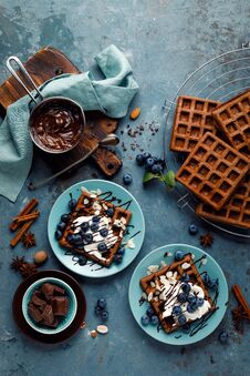 Chocolate Belgian Waffles With Ice Cream And Fresh Blueberry On Blue Background Stock Image