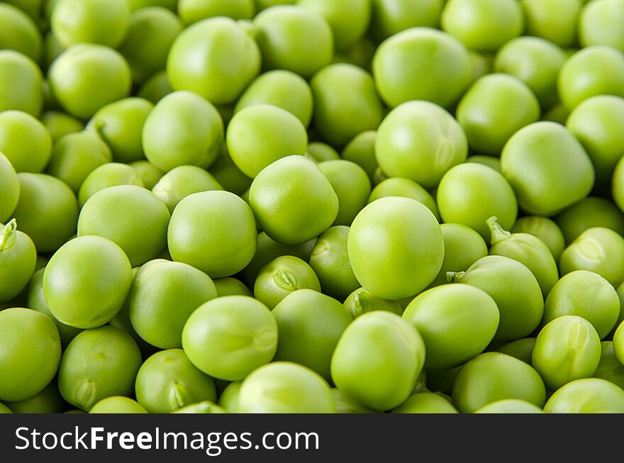 Fresh raw organic green pea background, vegetable pattern texture, selective focus