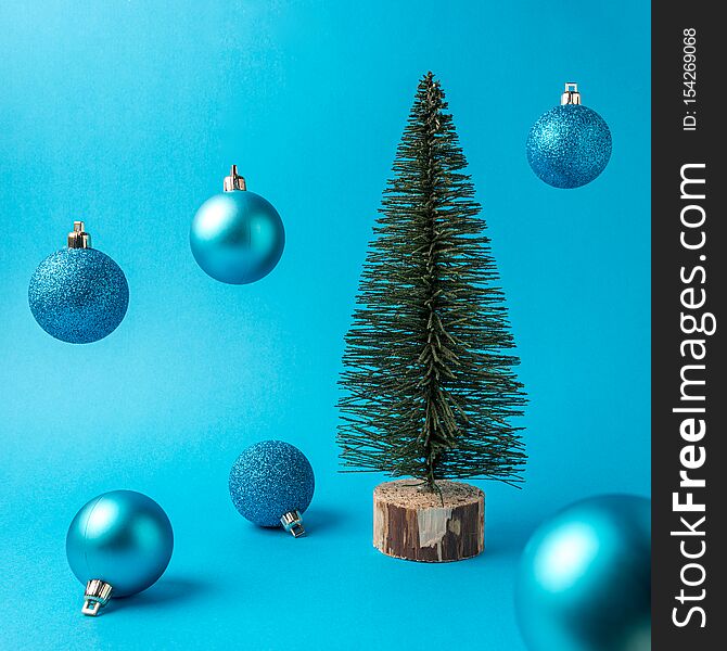 Christmas Tree With Christmas Decoration On Blue Background. Christmas Or New Year Minimal Concept