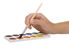 Watercolors And Hand With A Paintbrush Royalty Free Stock Photography