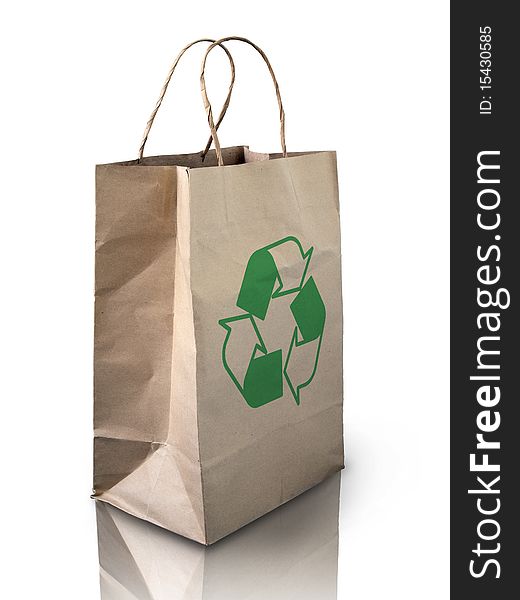 Recycle brow paper bag on reflect white floor. Recycle brow paper bag on reflect white floor