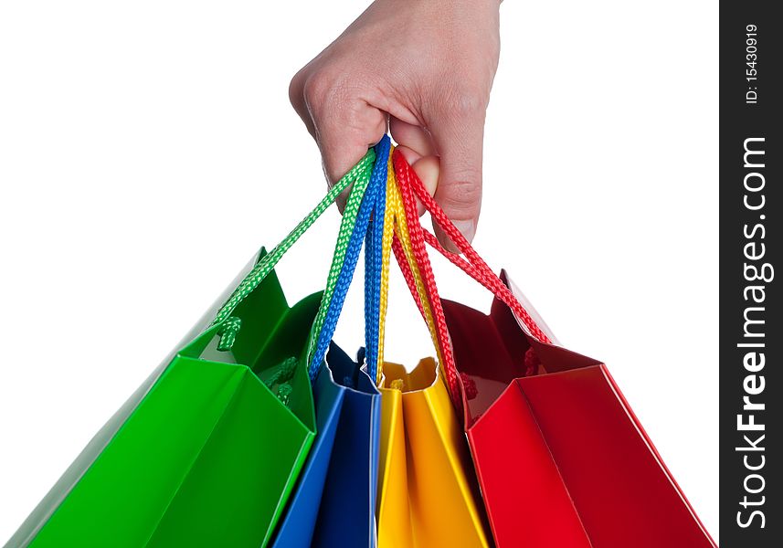 A hand is holding a shopping bag - isolated on a white background