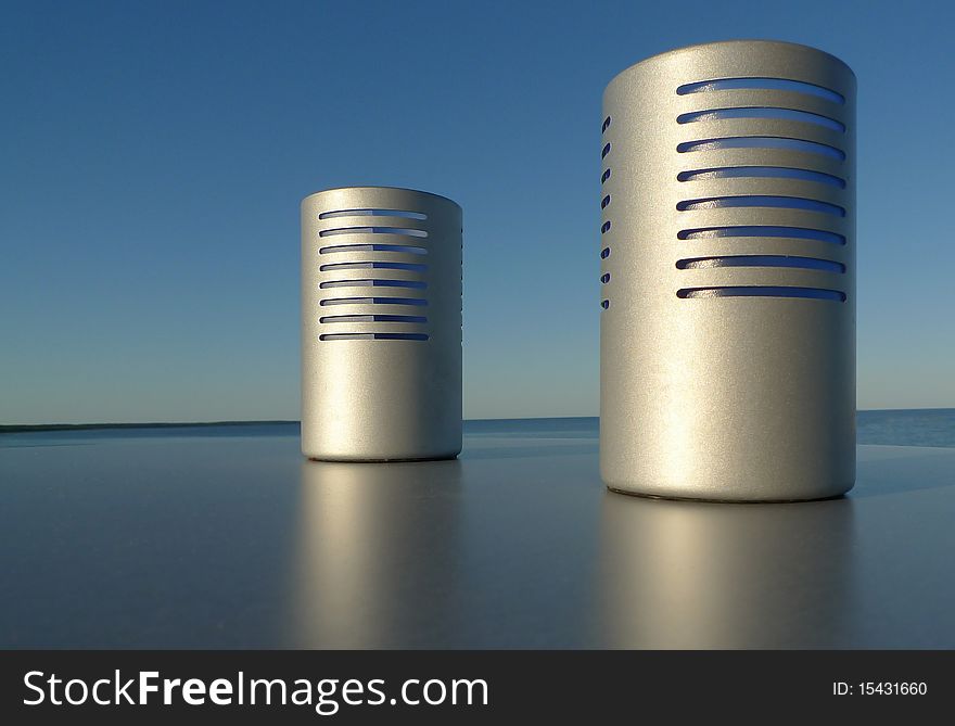 Candle light holder on a plain surface outdoor by the sea and with blue sky. Room for text. Sweden
