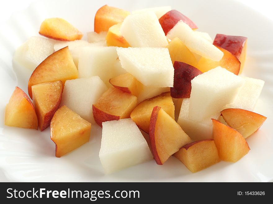 Melon and nectarine salad on an white plate