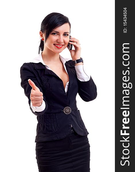 Attractive business woman on the phone making her ok sign