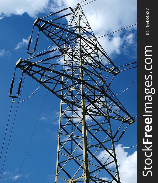 High-voltage line, pole against a blue sky