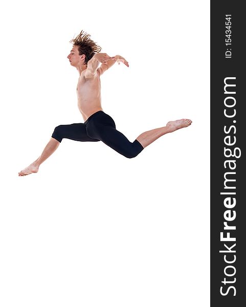 Young ballet dancer practicing high jumps over white