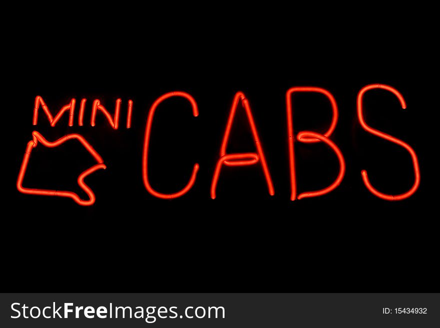 Red neon sign of the words 'MINI CABS' with a red arrow on a black background. Red neon sign of the words 'MINI CABS' with a red arrow on a black background.