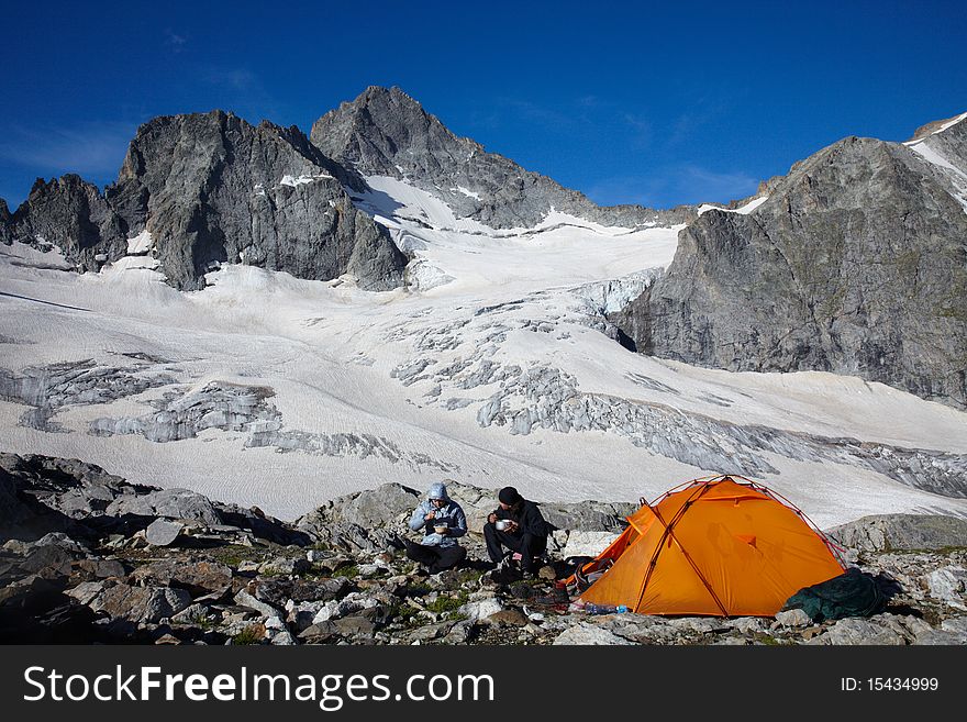 Couple of tourists having a breakfast near of tent