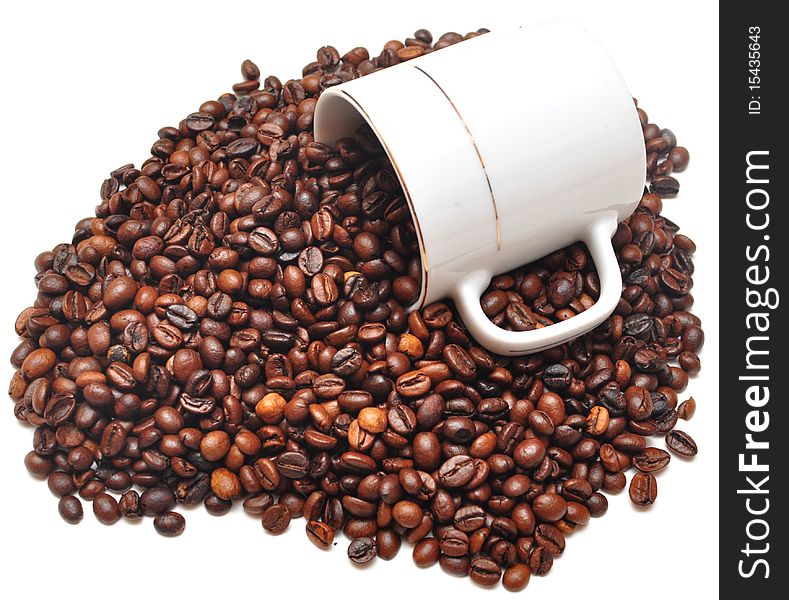 Some coffee beans falling from a coffee cup on white background