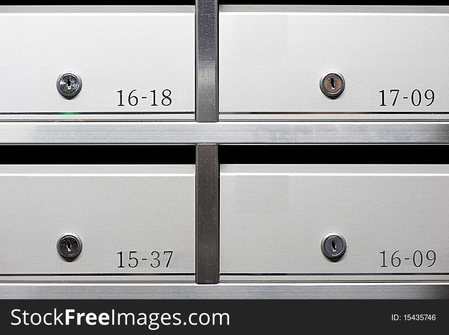 Metallic mailbox array tidy inside apartment houses