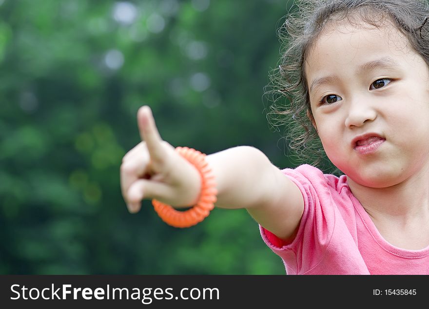 Happy little girl in a garden