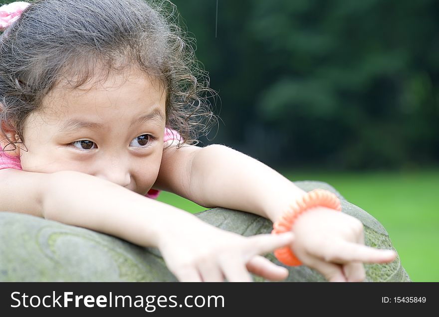 Happy little girl in a park