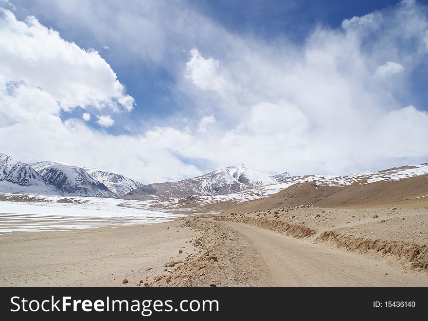 Remote, desolate high mountain road through the Himalayas, India. Remote, desolate high mountain road through the Himalayas, India.