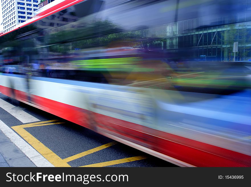 High-speed and blurred bus trails on downtown road