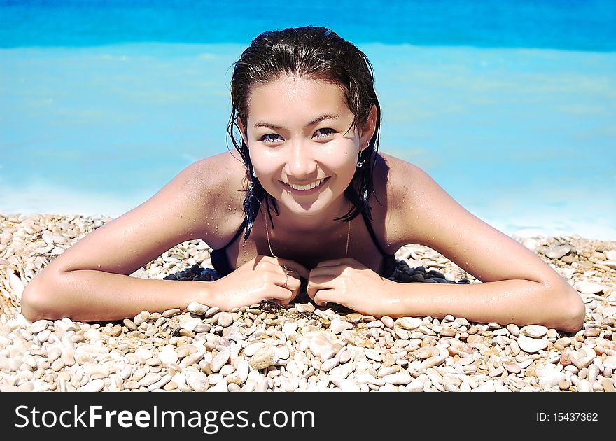 Young Girl lies on the beach. Young Girl lies on the beach