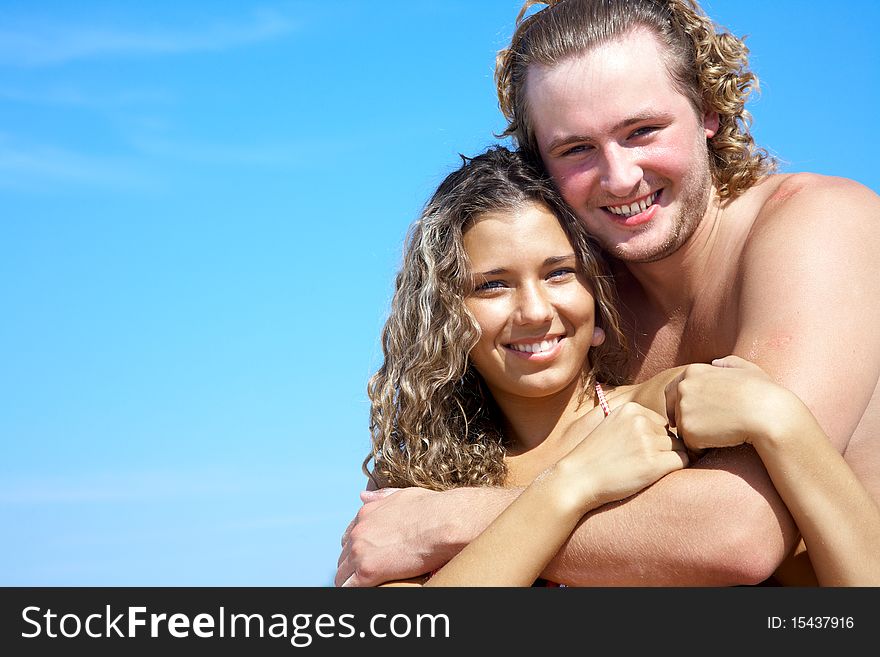 Closeup portrait of happy couple enjoying vacations on the beach. Closeup portrait of happy couple enjoying vacations on the beach