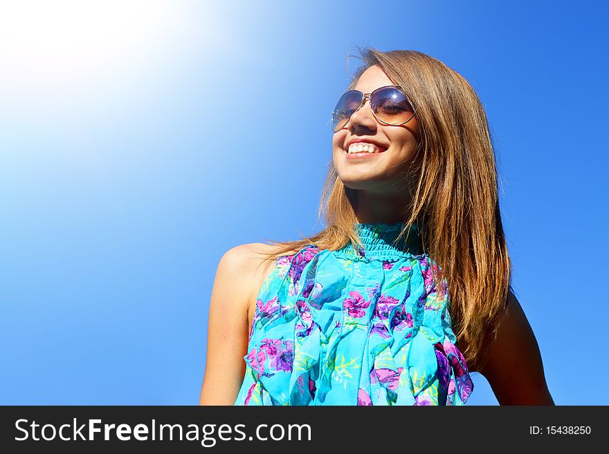 Joyful girl on a blue background on a light background