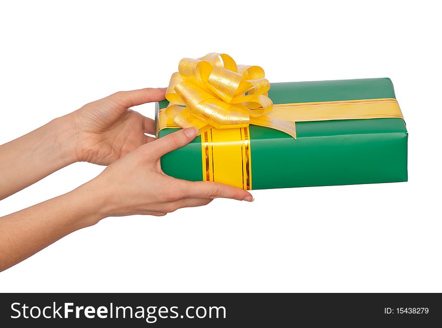 Woman giving a green box with yellow bow as a gift