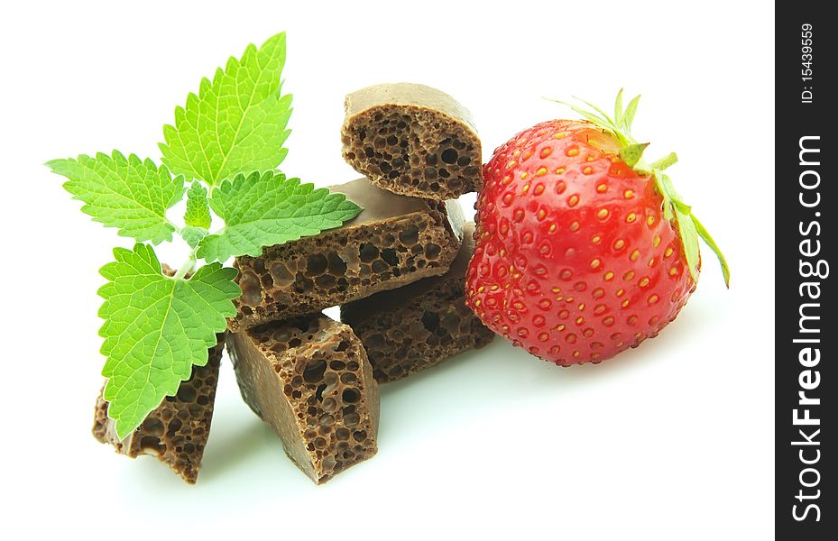 Porous chocolate with mint and a strawberry. Porous chocolate with mint and a strawberry