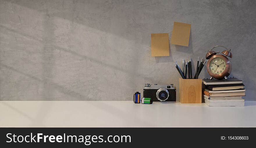 Simple photographer workplace with vintage camera