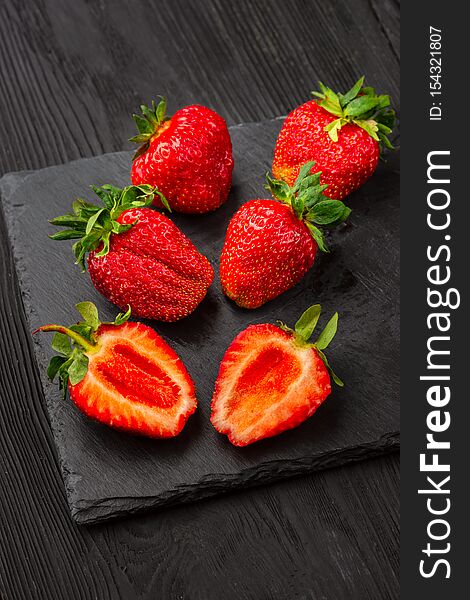 Fresh strawberries on dark background