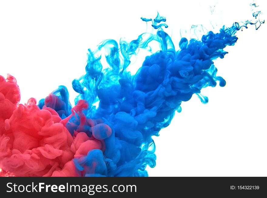 Red and blue acrylic ink in water on white background. Abstract background. Red and blue acrylic ink in water on white background. Abstract background