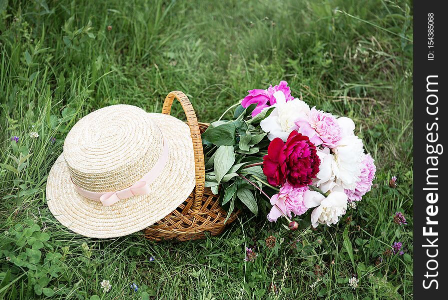 Basket with peony flowers