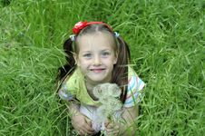 The Girl In A Grass Royalty Free Stock Photo The Girl In A Grass Royalty Free Stock Photo