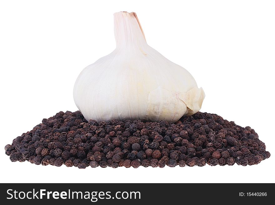 Black pepper not ground on a white background.