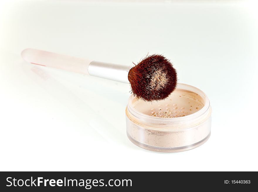 Stylish makeup brush in cosmetic pouder