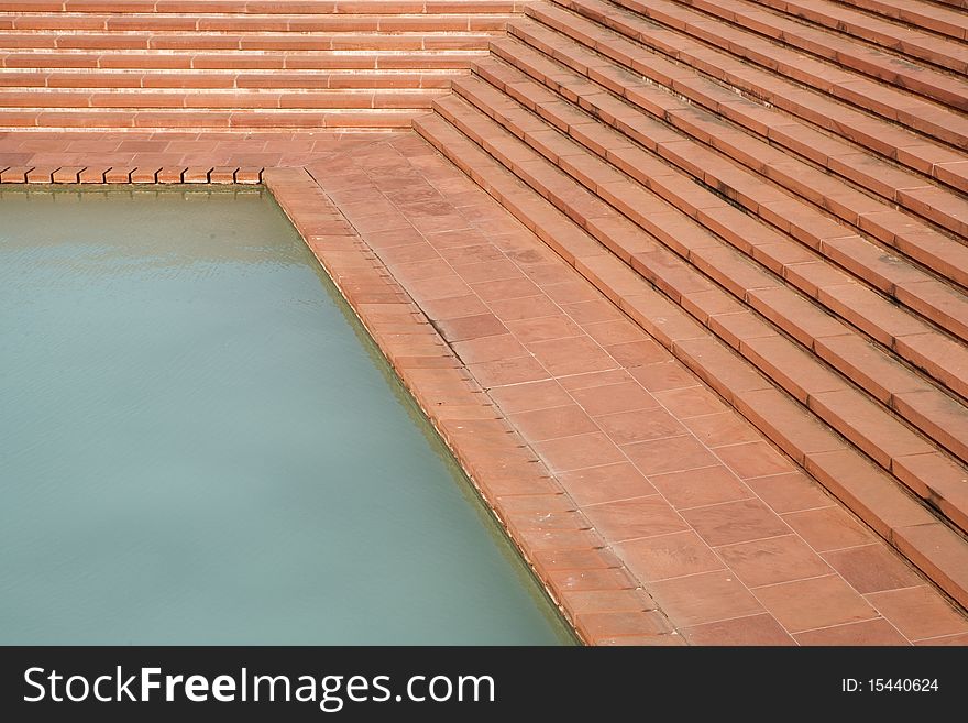 Pool with stairs at Lotus Temple in Delhi.