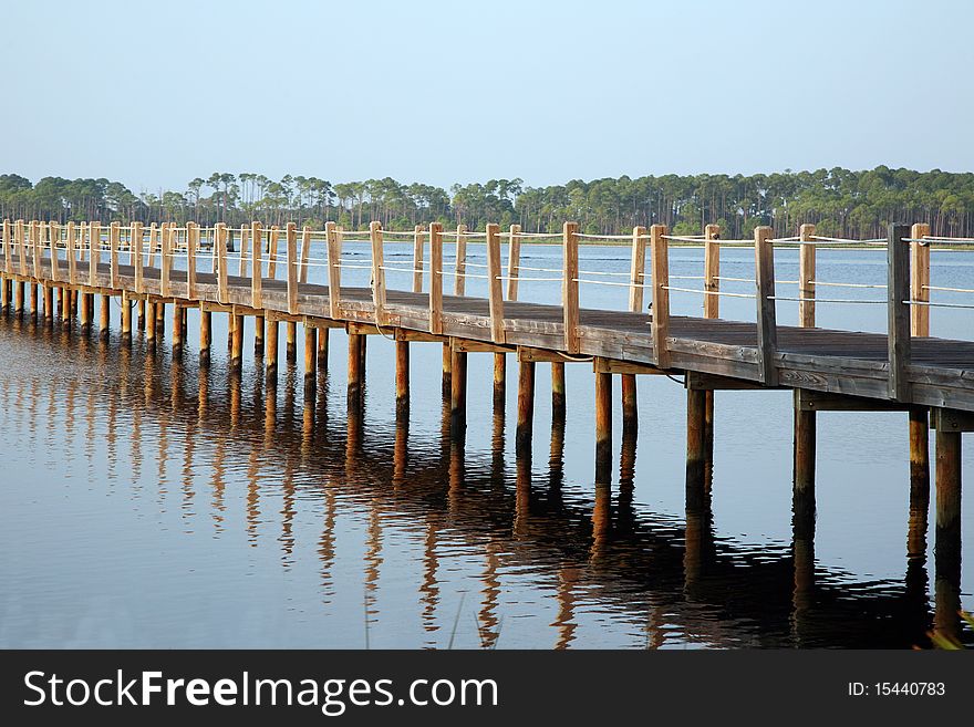 Detailed image of a boardwalk leading out into the water.