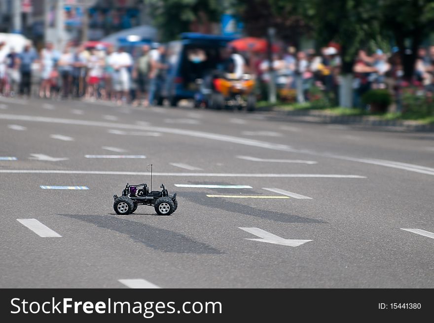 Electric toy car in the middle of the road.