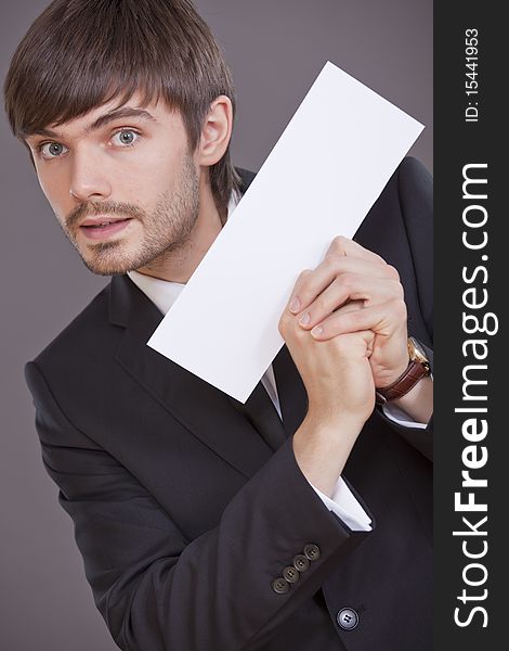 Happy businessman holding blank card to write your own message. Happy businessman holding blank card to write your own message