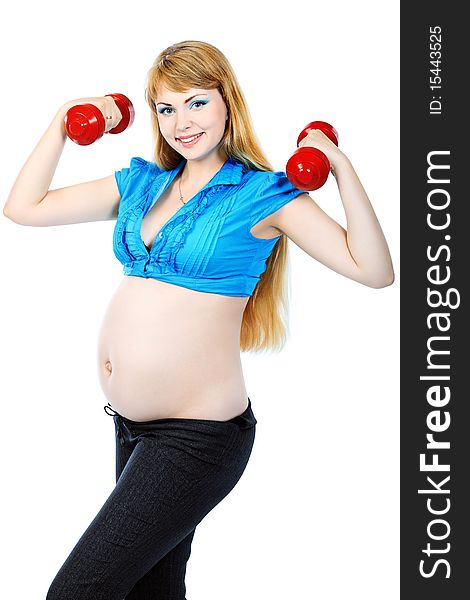 Portrait of pregnant woman training with dumbbells. Isolated over white background. Portrait of pregnant woman training with dumbbells. Isolated over white background.