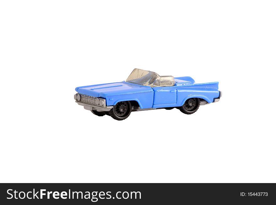 Funky old dirty plastic small toy blue cabriolet car on white.