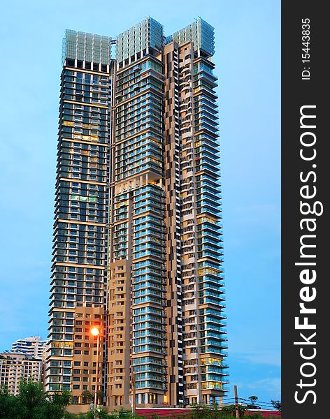 The high rise building under construction in twilight time