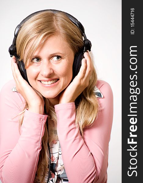 Women listening music, she is smiling