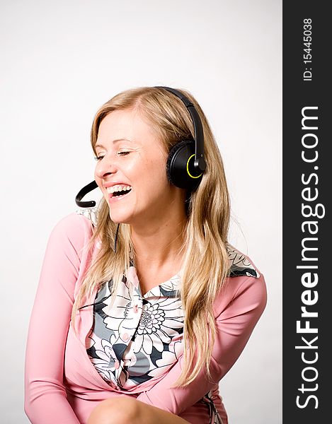 Women with headphones laughing of something