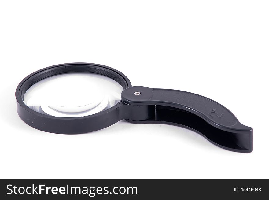 Magnifying glass in a black frame with the collapsible handle