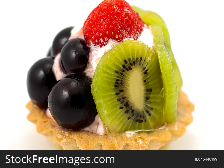 A delicious fruit tart made with strawberries,grapes and kiwi.